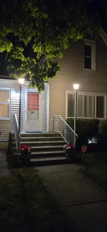 a view of a house with backyard and porch