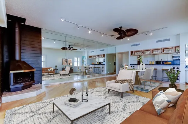 a living room with furniture and a fireplace