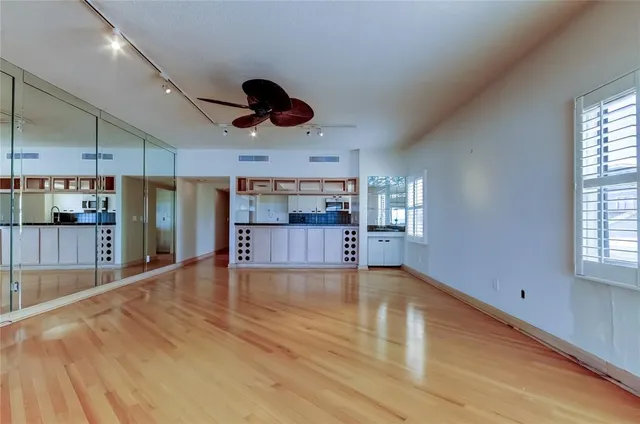 a view of a kitchen with a sink and a window