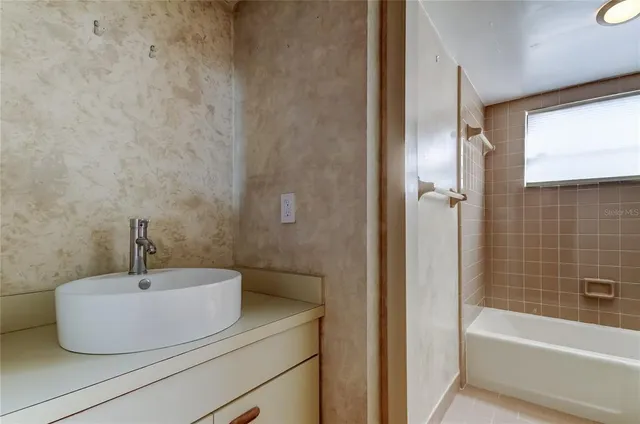 a bathroom with a bathtub and a toilet