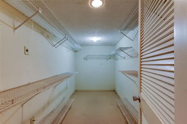 a view of a porch with a table and chairs