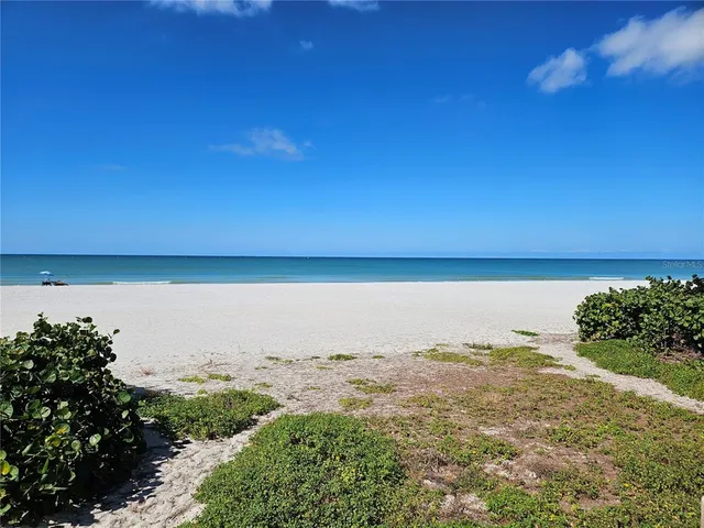 a view of lake with mountain in background