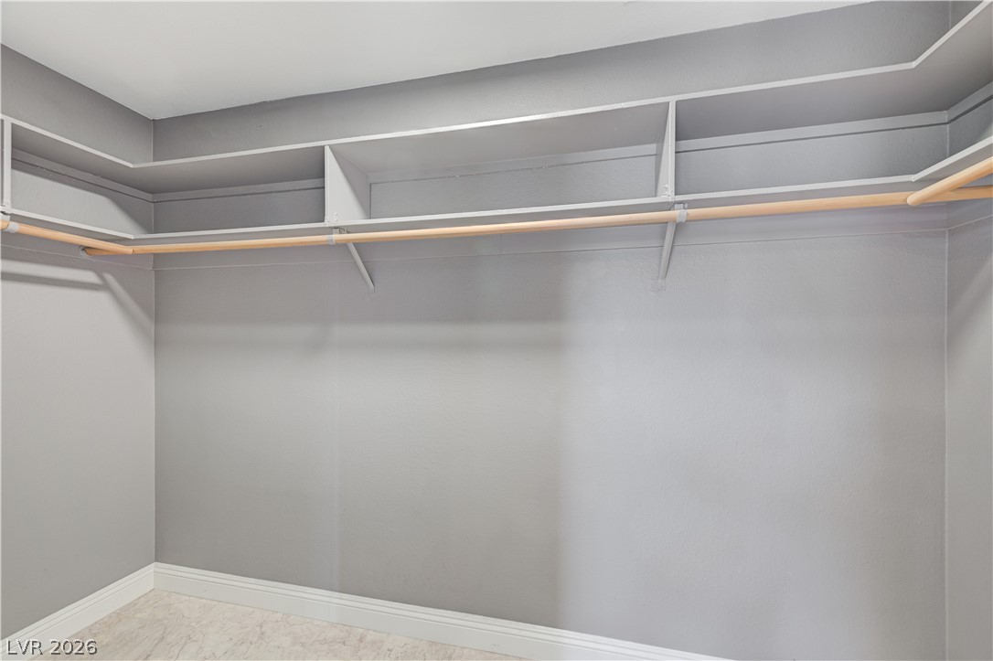 6635 Costa Brava Road Las Vegas, NV 89146 - Photo 33 of 59 Functional closet system offering both hanging rods and elevated shelving.