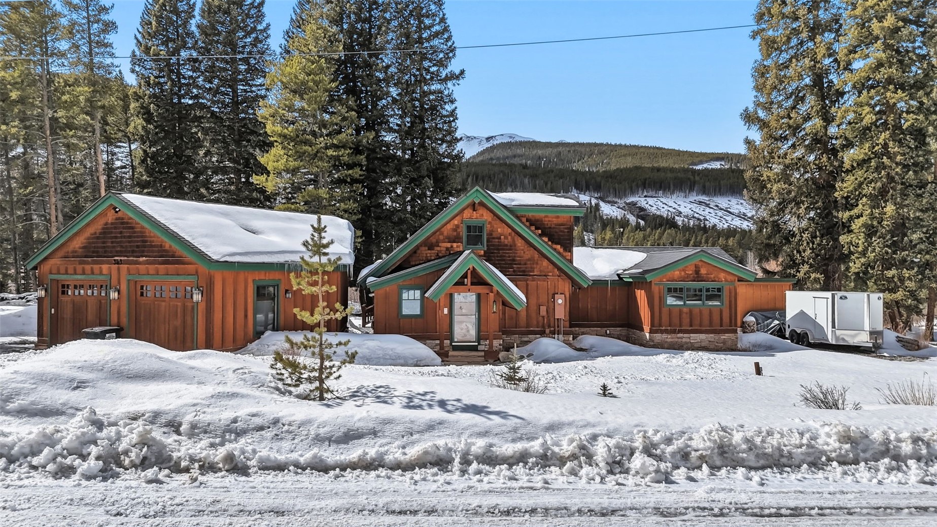 353 Blue River Road Blue River, CO 80424 - Photo 2 of 50 a front view of a house with a yard covered in snow