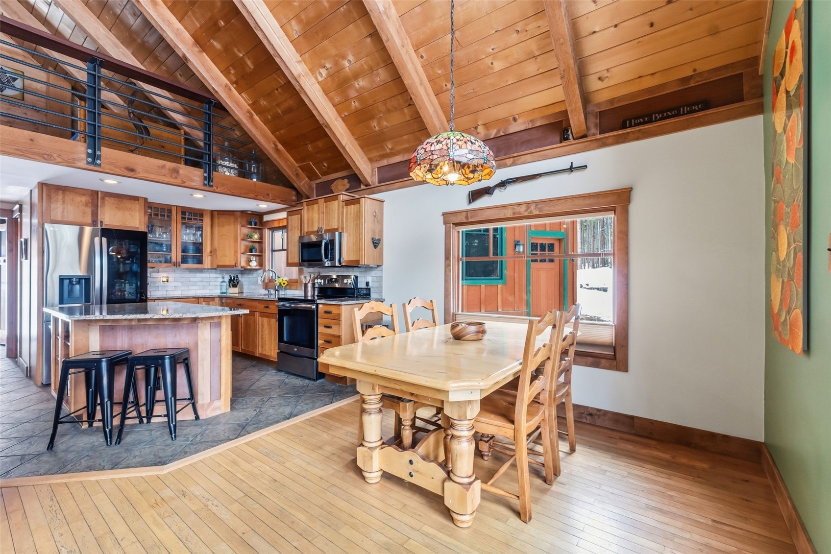 353 Blue River Road Blue River, CO 80424 - Photo 8 of 50 a view of a dining room with furniture and wooden floor