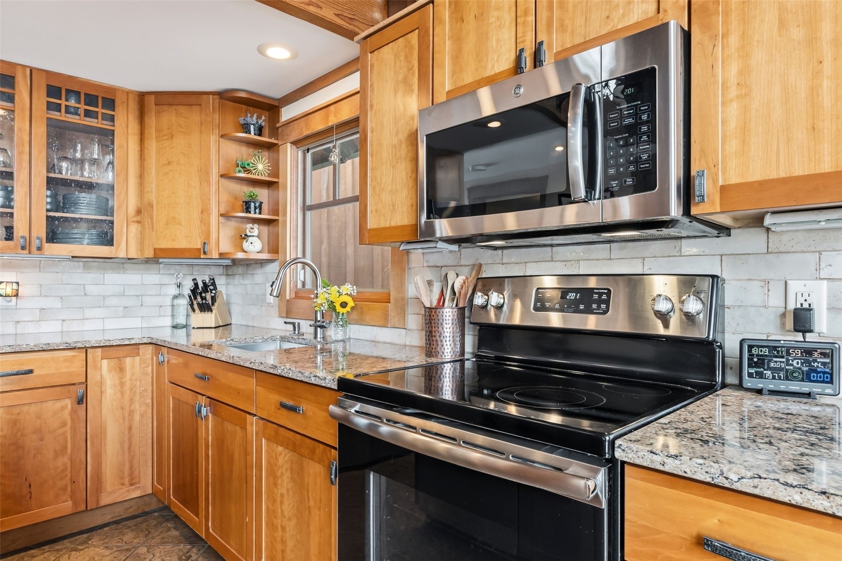 353 Blue River Road Blue River, CO 80424 - Photo 9 of 50 a kitchen with stainless steel appliances granite countertop a stove microwave and sink