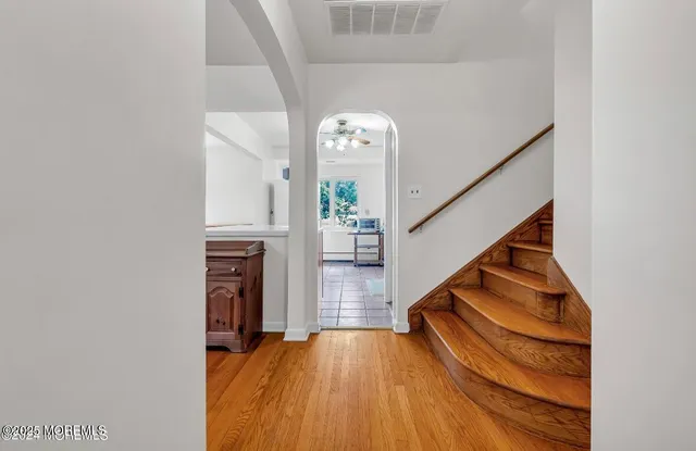a view of entryway with wooden floor