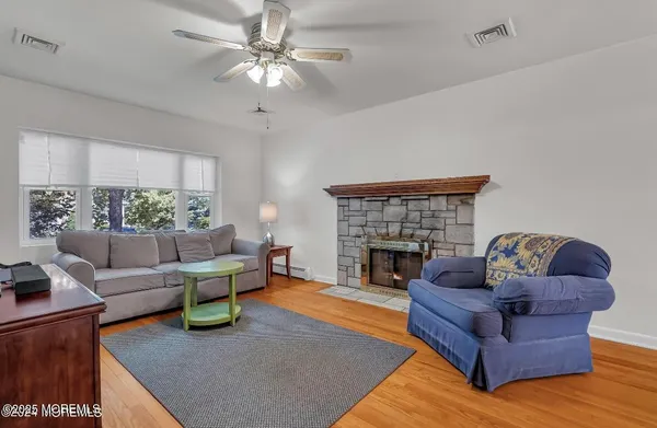a living room with furniture and a fireplace