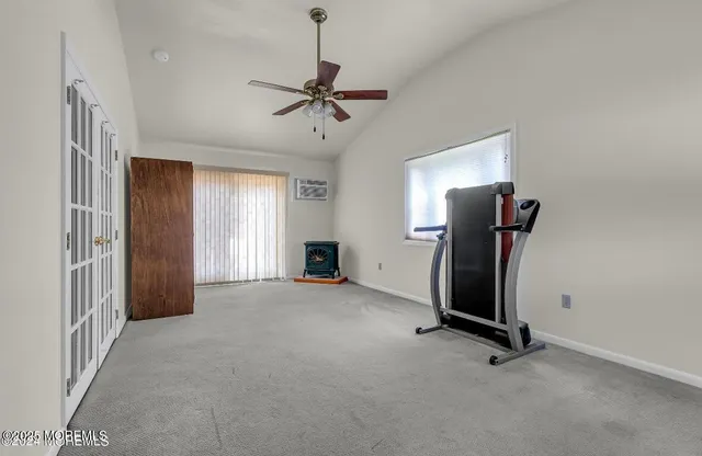 a view of room with window and ceiling fan