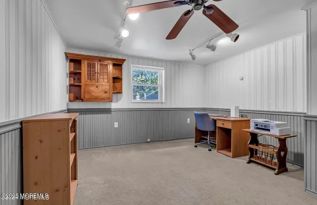 a view of workspace with furniture and window