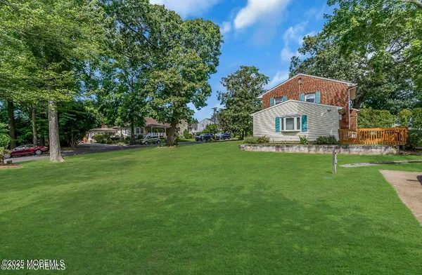 a view of a house with a big yard