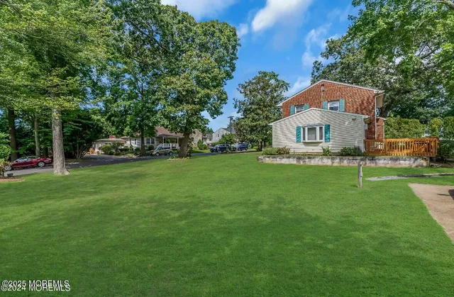a view of a house with a big yard