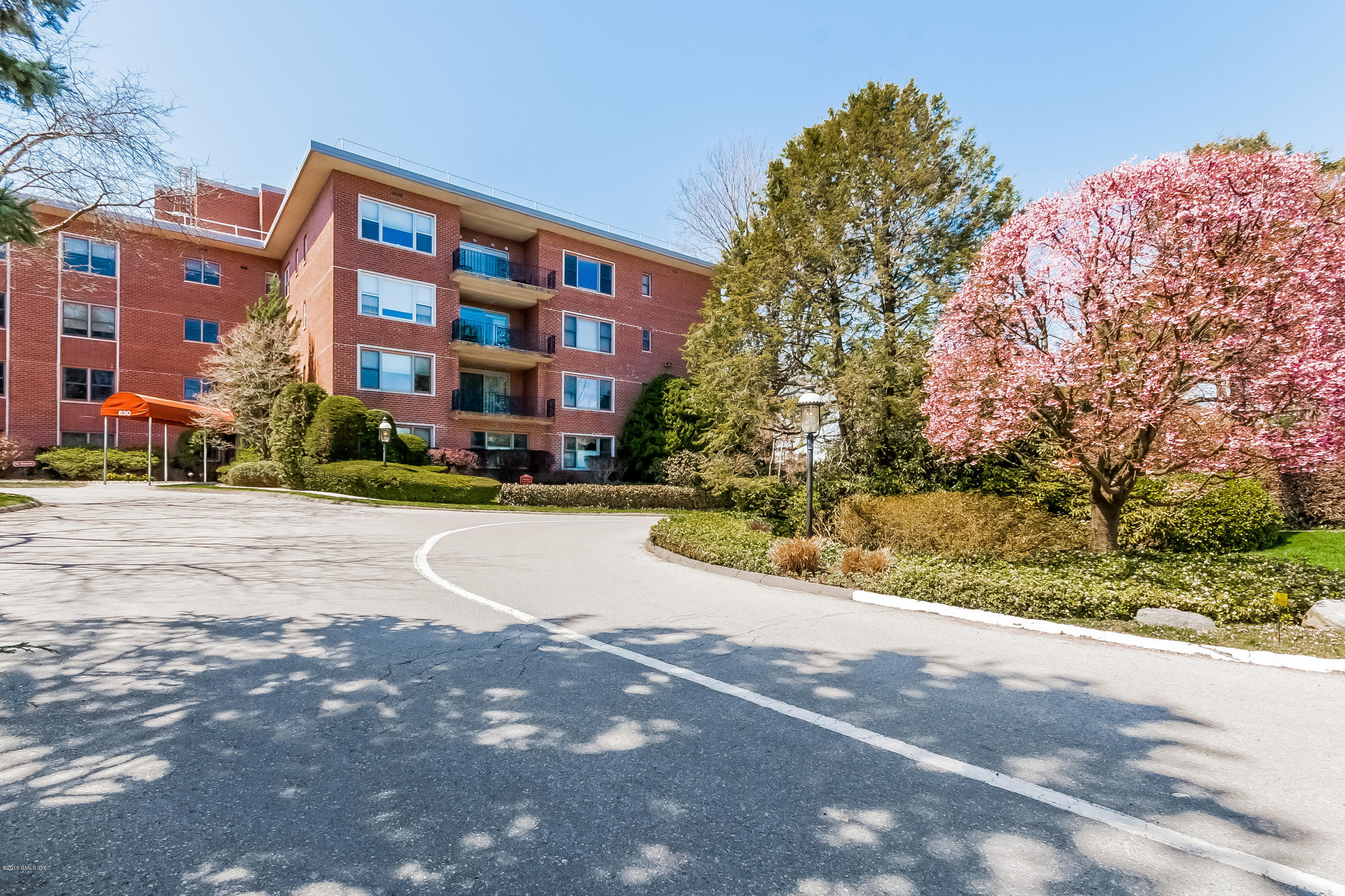 630 Steamboat Road, Unit 4D Greenwich, CT 06830 - Photo 1 of 11 a view of building with yard