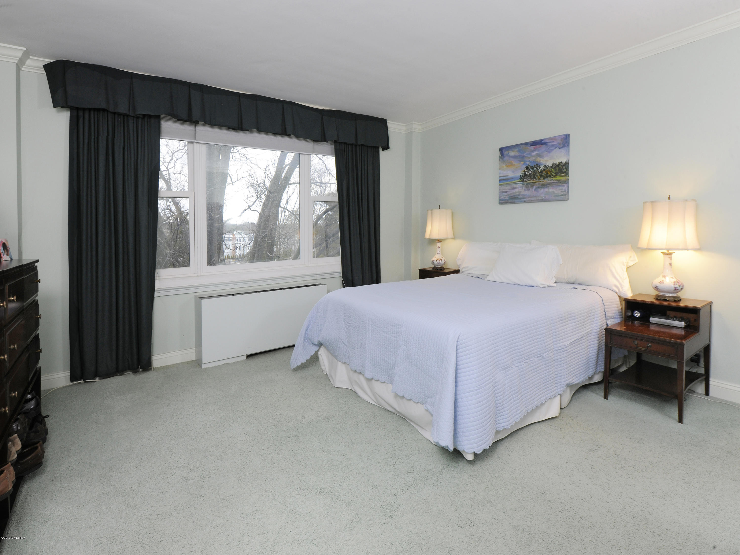 630 Steamboat Road, Unit 4D Greenwich, CT 06830 - Photo 10 of 11 a bedroom with a bed and a window
