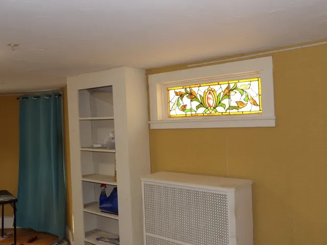 a room with toys and dresser