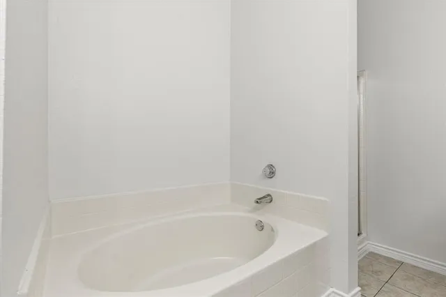a white bath tub and shower