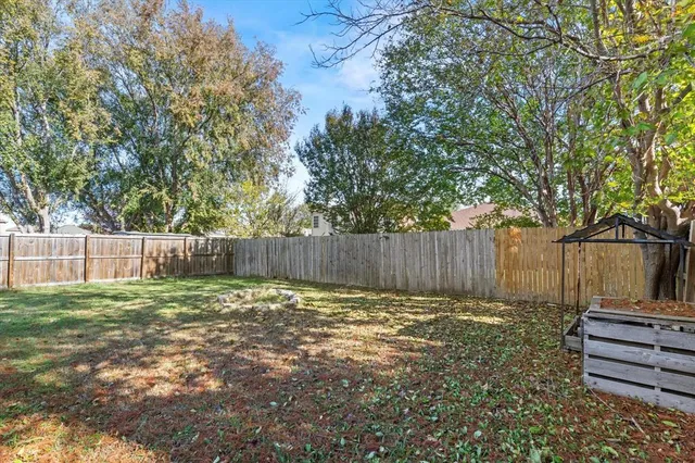 a view of a backyard with a trees
