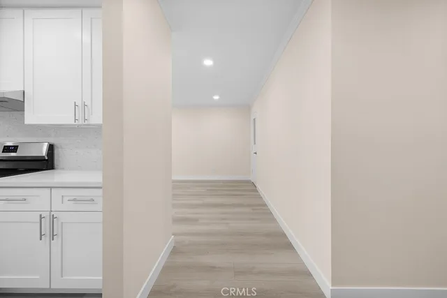 a view of an entryway with wooden floor