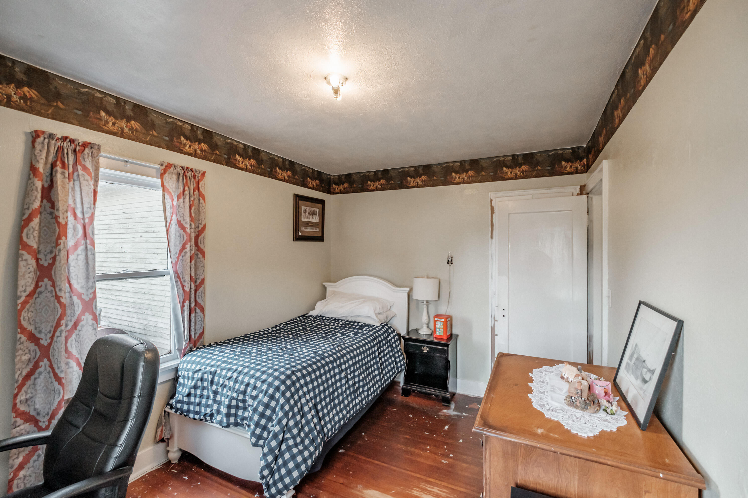 12495 Clow Corner Road Dallas, OR 97338 - Photo 20 of 50 a bedroom with a bed and wooden floor