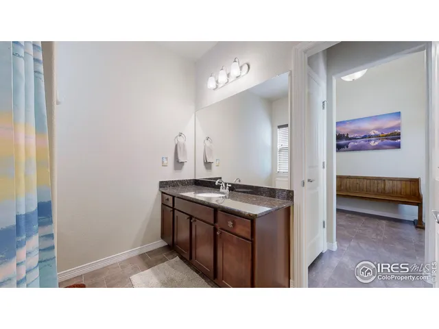 a bathroom with a sink a vanity and a mirror