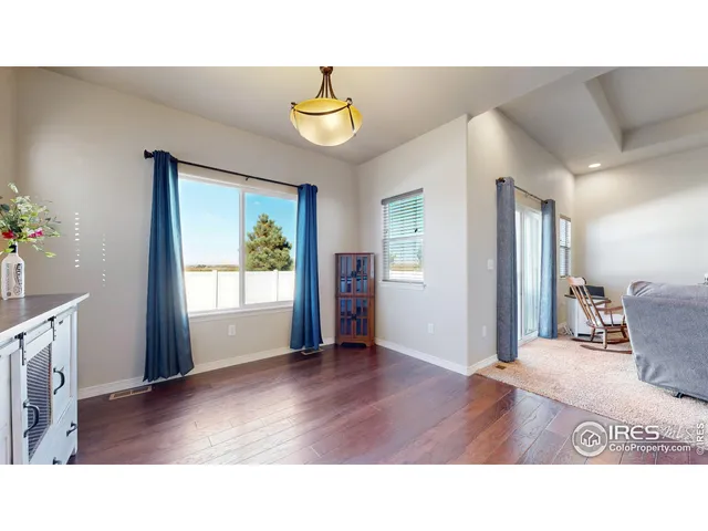 a living room with a couch and potted plant