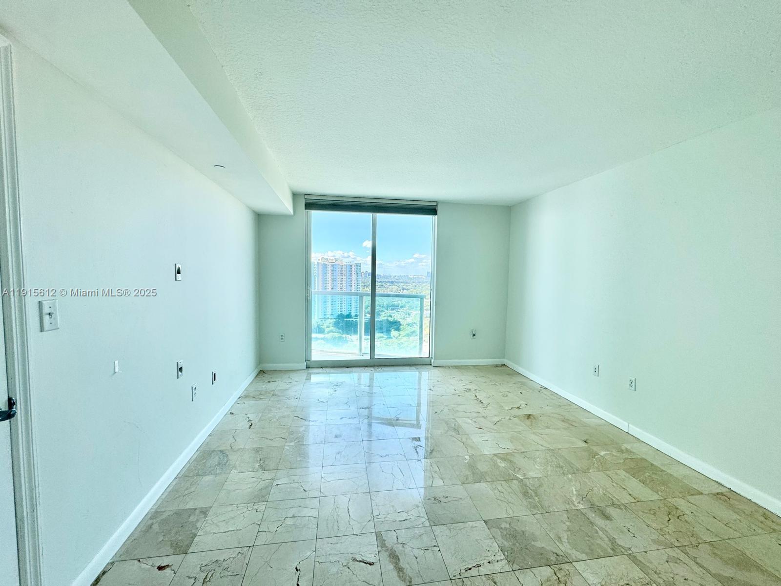2101 Brickell Avenue, Unit 2411 Miami, FL 33129 - Photo 2 of 10 a view of an empty room with a window