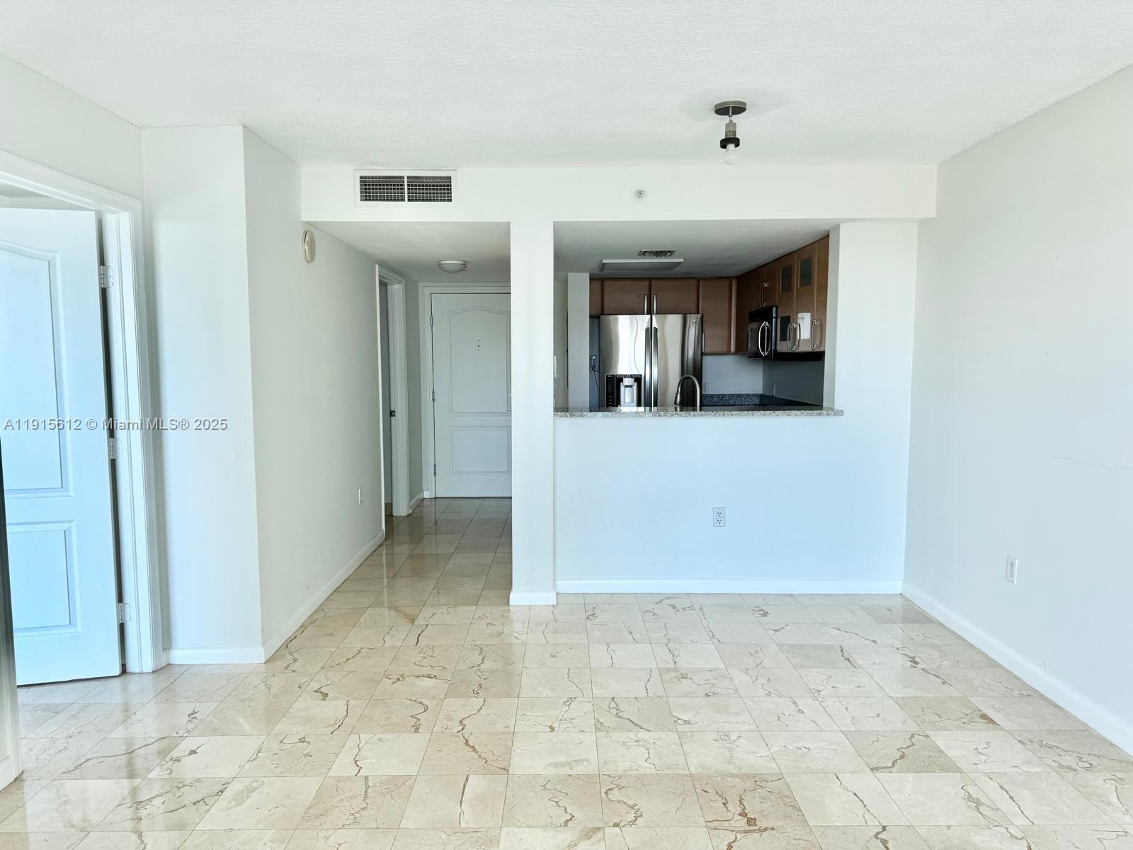 2101 Brickell Avenue, Unit 2411 Miami, FL 33129 - Photo 3 of 10 a view of a hallway with a bathroom