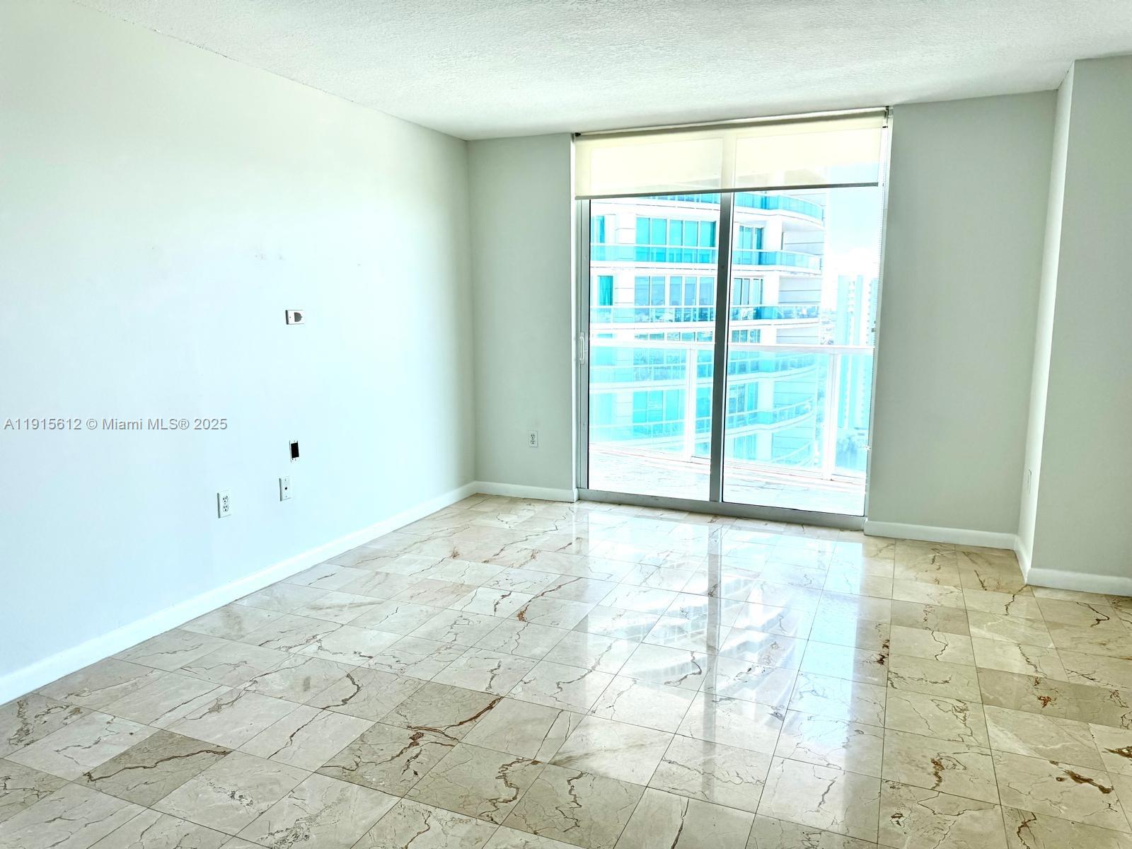 2101 Brickell Avenue, Unit 2411 Miami, FL 33129 - Photo 4 of 10 a view of an empty room and window