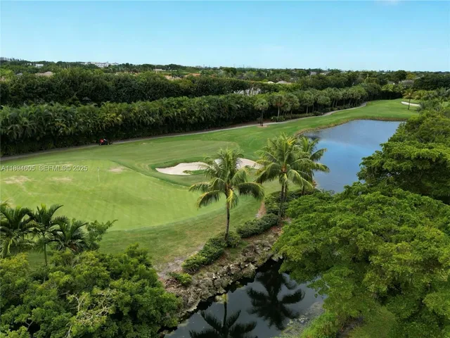 a view of a lake with a yard