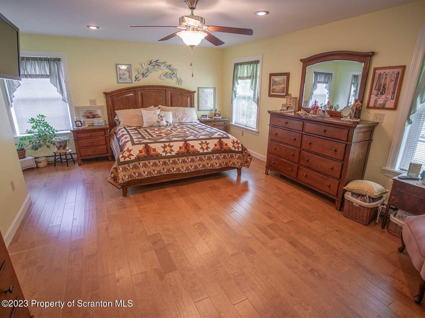 1170 Ridge Road Montgomery, PA 17752 - Photo 15 of 24 a bedroom with a bed and wooden floor