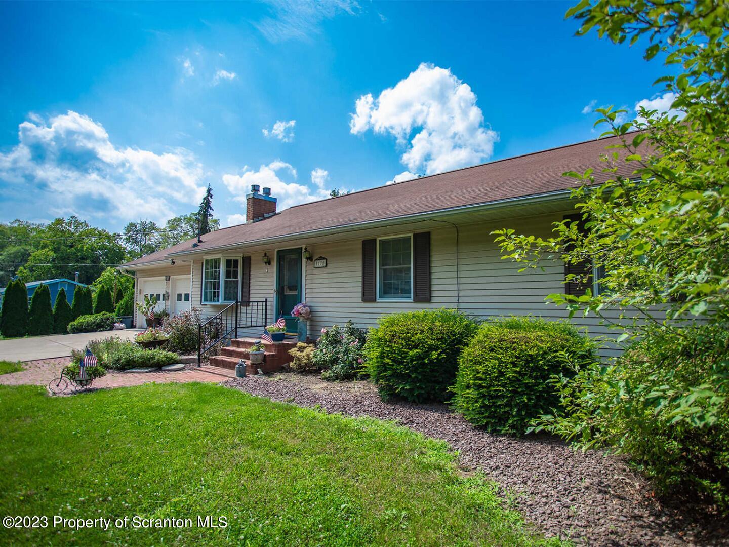 1170 Ridge Road Montgomery, PA 17752 - Photo 2 of 24 a view of a patio with couches table and chairs and potted plants