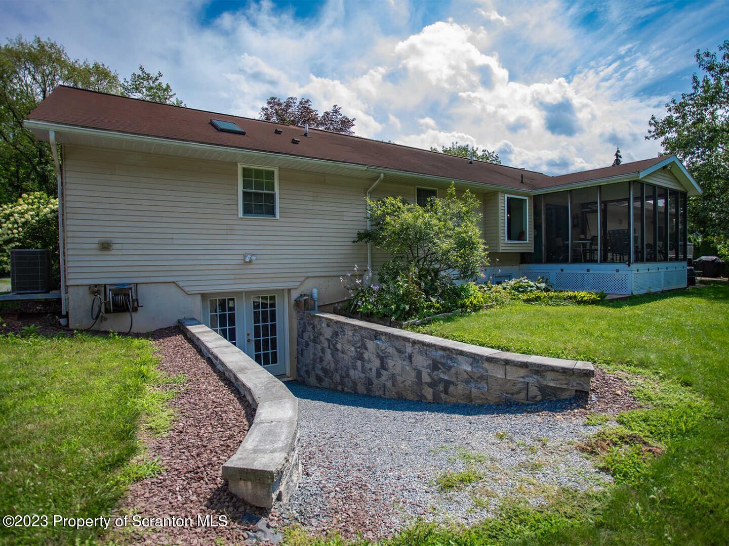 1170 Ridge Road Montgomery, PA 17752 - Photo 22 of 24 a view of a house with backyard and sitting area