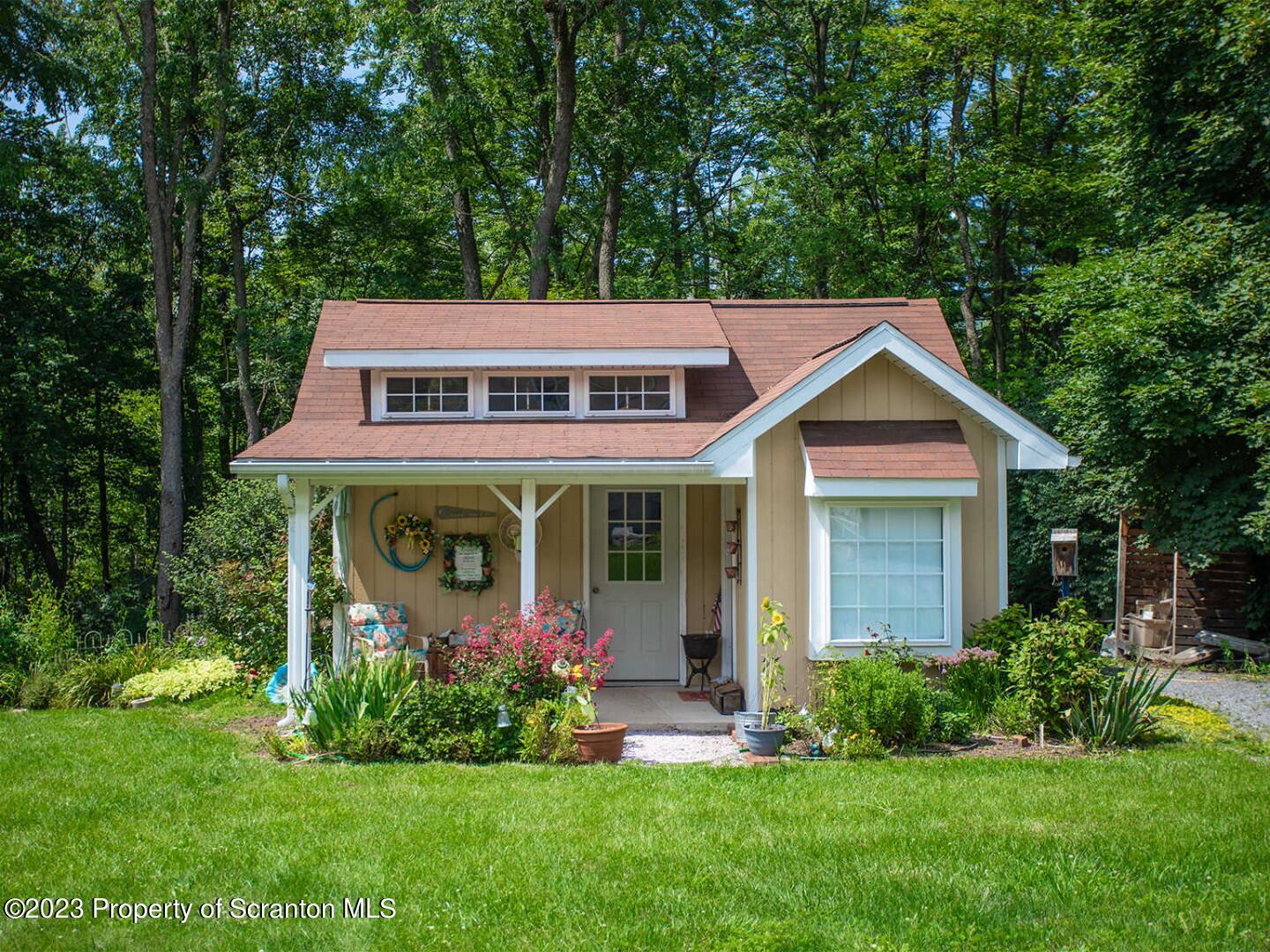 1170 Ridge Road Montgomery, PA 17752 - Photo 3 of 24 a view of a house with garden