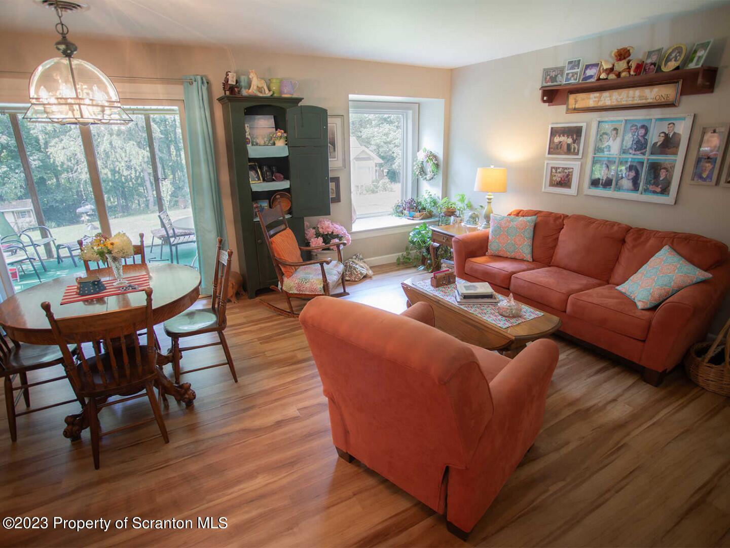 1170 Ridge Road Montgomery, PA 17752 - Photo 8 of 24 a living room with furniture and a chandelier