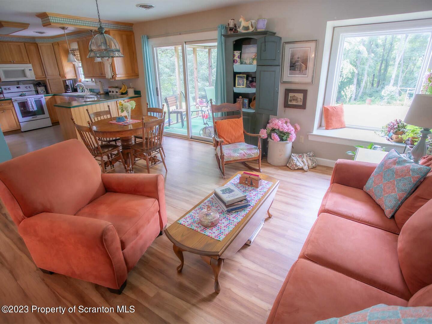 1170 Ridge Road Montgomery, PA 17752 - Photo 9 of 24 a living room with furniture a rug and a large window