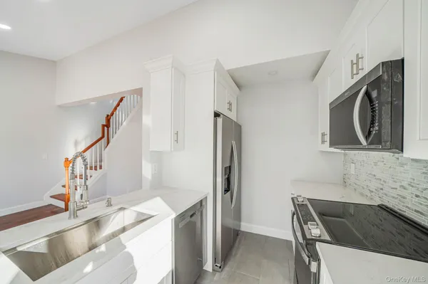 a view of an empty room with stairs