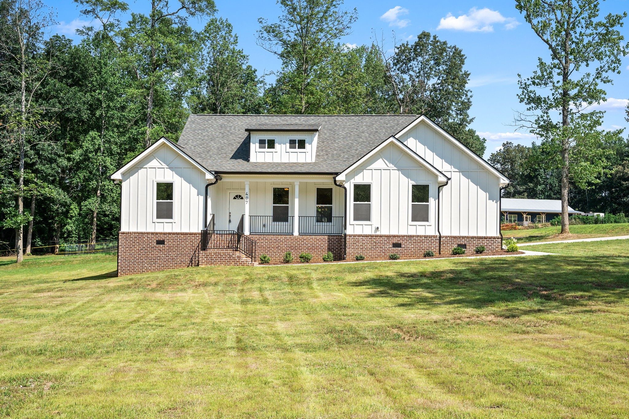 407 Spring Meadows Lane Morrison, TN 37357 - Photo 1 of 25 a front view of a house with a yard