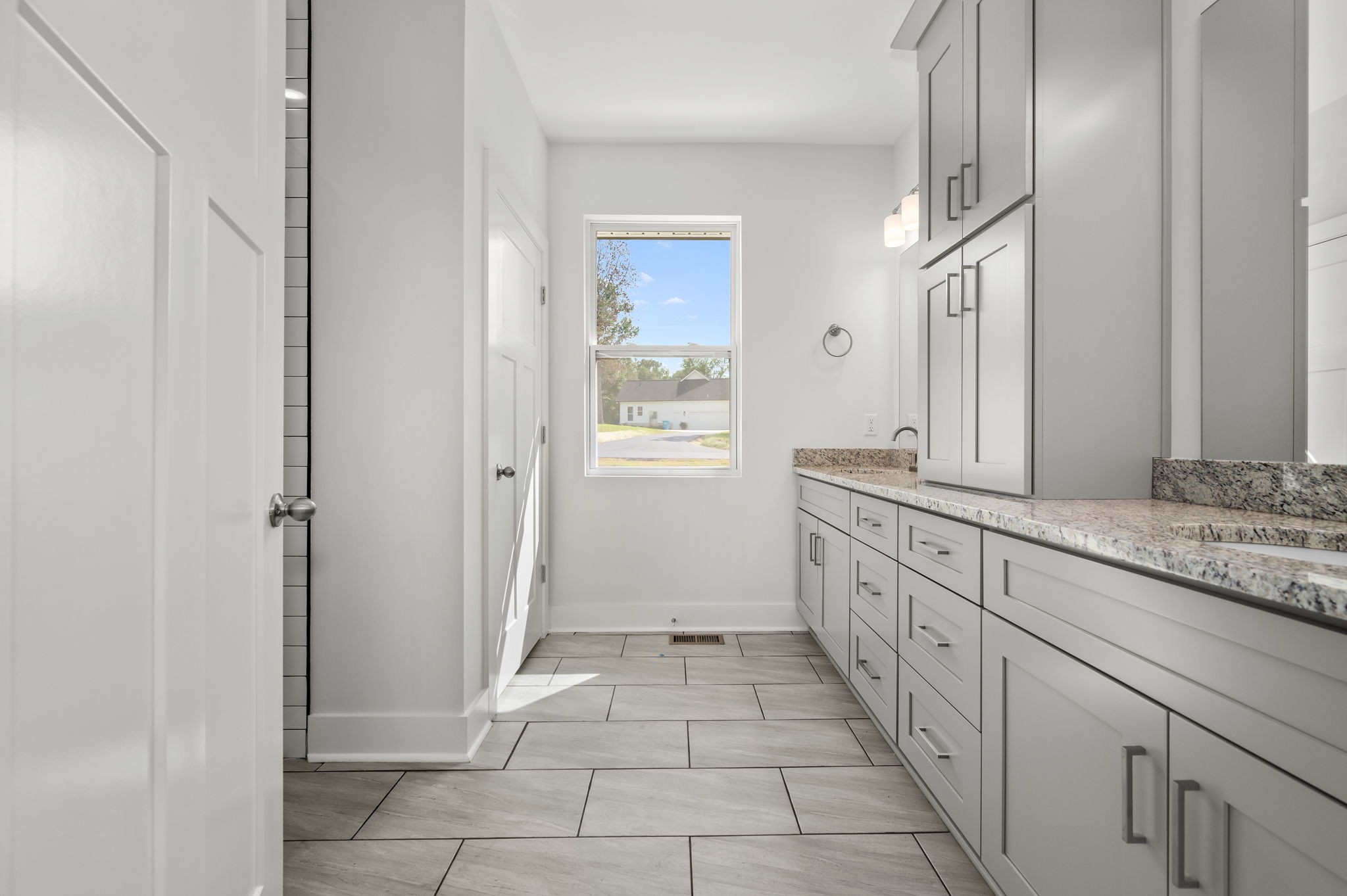 407 Spring Meadows Lane Morrison, TN 37357 - Photo 15 of 25 a spacious bathroom with a granite countertop sink a mirror and a