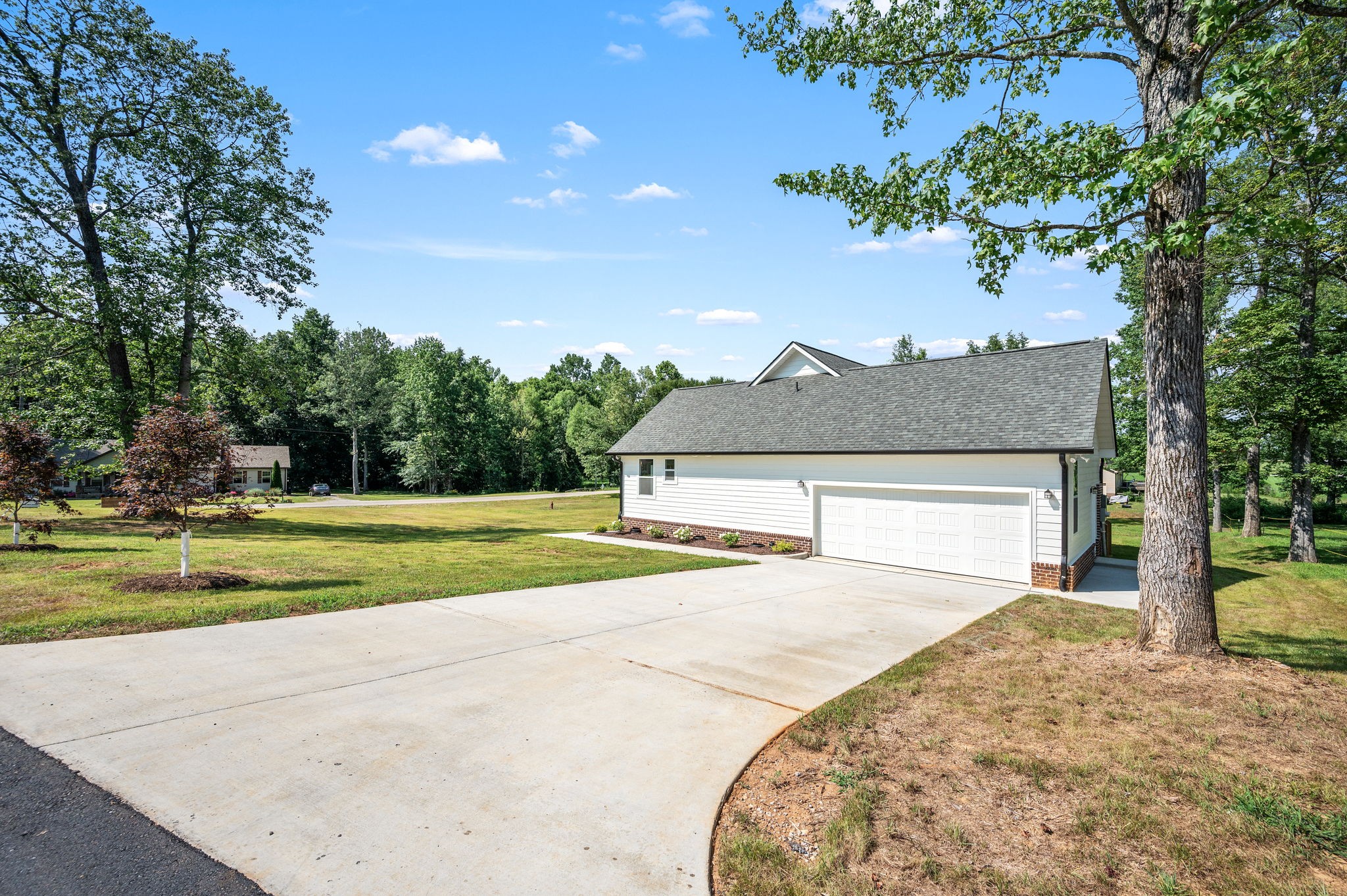 407 Spring Meadows Lane Morrison, TN 37357 - Photo 24 of 25 a view of a house with a yard and large tree