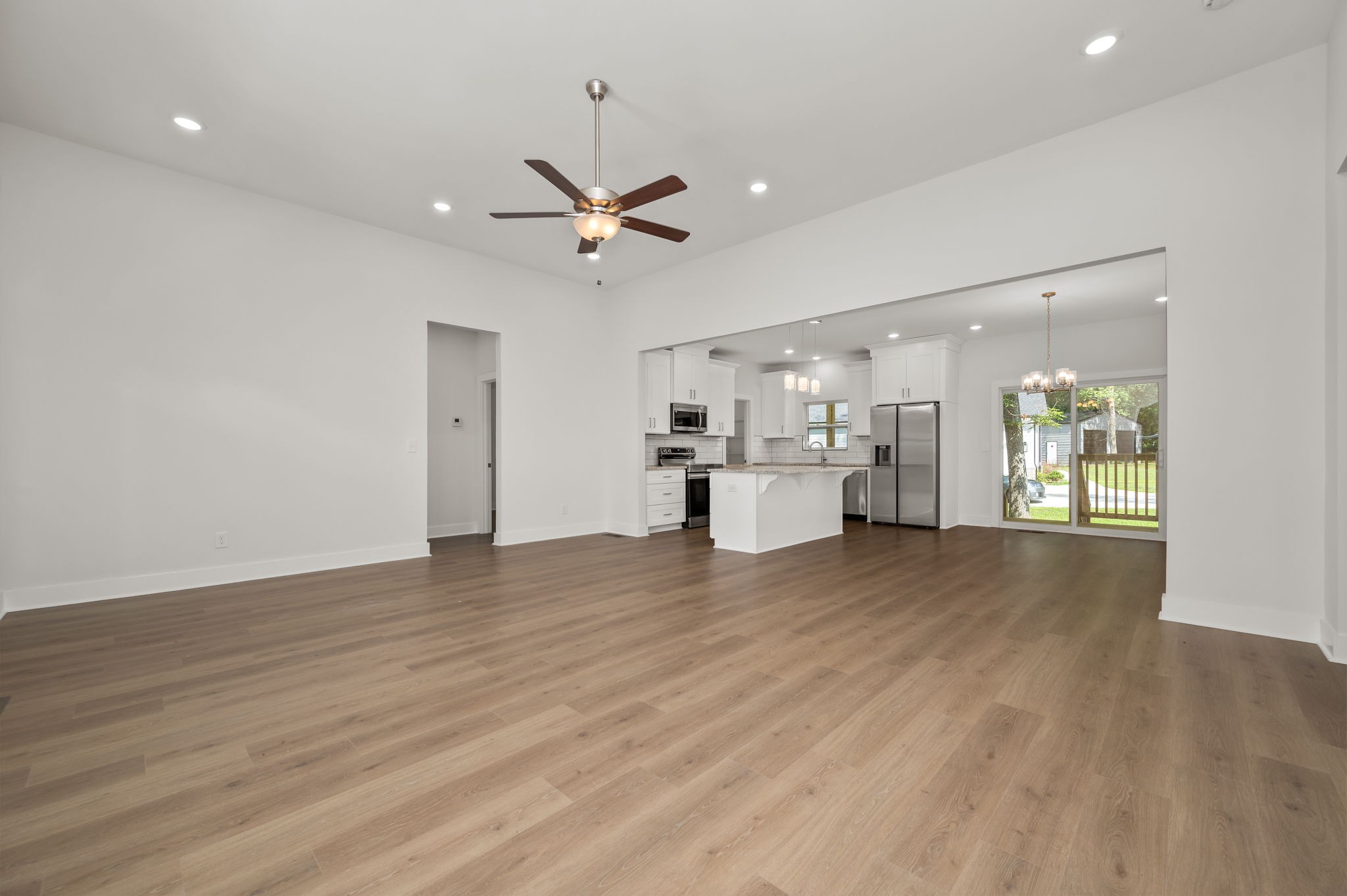 407 Spring Meadows Lane Morrison, TN 37357 - Photo 5 of 25 a view of empty room with wooden floor and window
