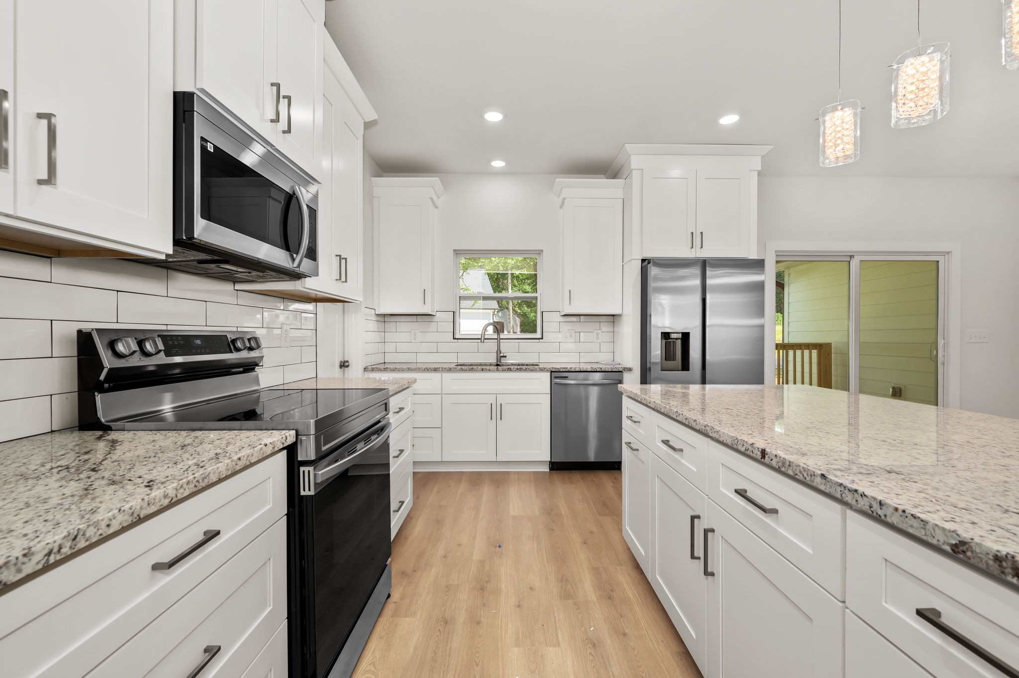 407 Spring Meadows Lane Morrison, TN 37357 - Photo 10 of 25 a large kitchen with stainless steel appliances granite countertop a stove a sink and a microwave