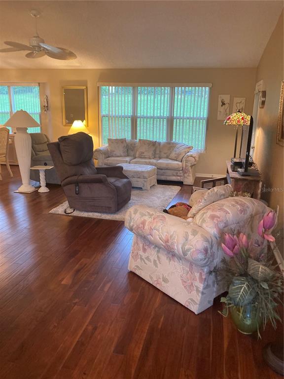 8744 Southwest 108th Ln Road Ocala, FL 34481 - Photo 2 of 28 a living room with furniture and wooden floor