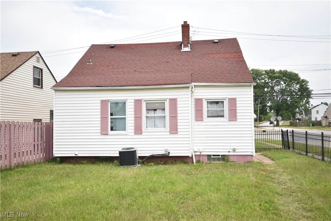5840 Turney Road Cleveland, OH 44125 - Photo 20 of 21 Back of property featuring central AC and a lawn