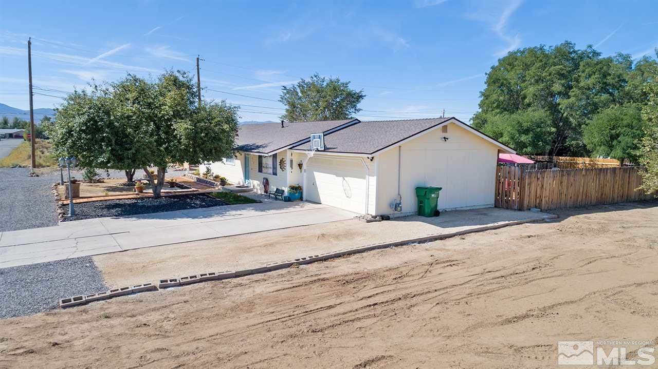 212 Ring Road Dayton, NV 89403 - Photo 19 of 19 a view of a white house with a street