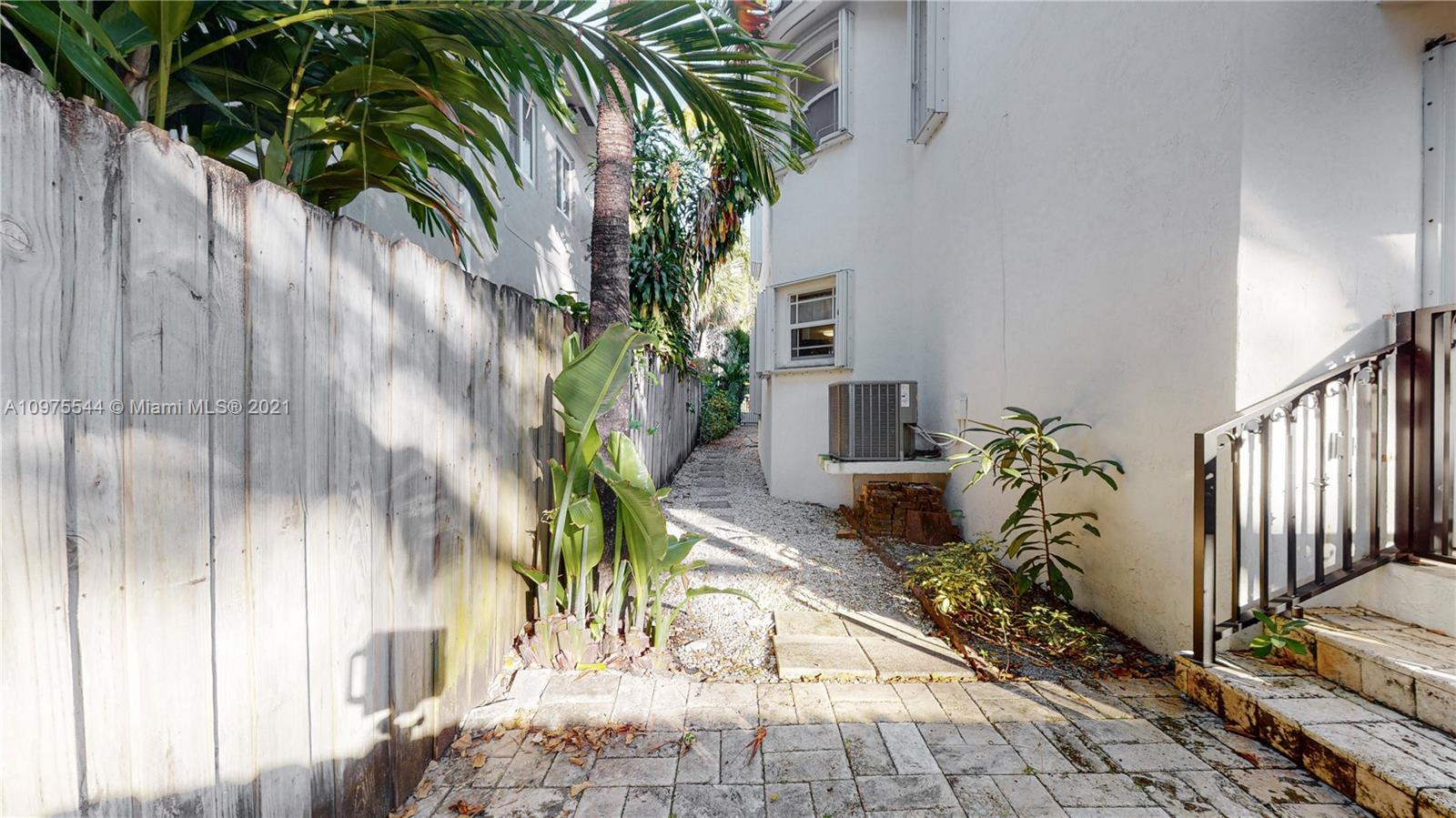 3088 Mary Street, Unit 2 Miami, FL 33133 - Photo 15 of 35 a potted plant sitting in front of a house