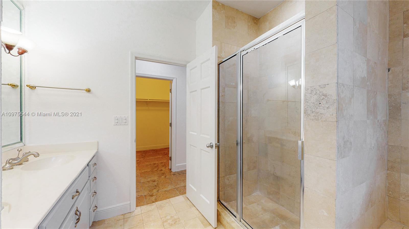 3088 Mary Street, Unit 2 Miami, FL 33133 - Photo 21 of 35 a bathroom with a shower sink and mirror