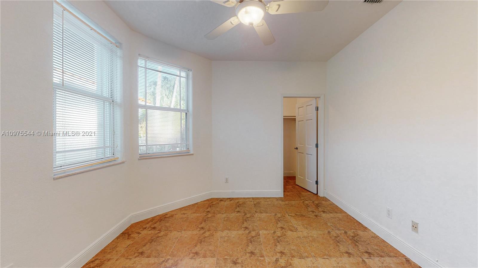 3088 Mary Street, Unit 2 Miami, FL 33133 - Photo 25 of 35 an empty room with windows