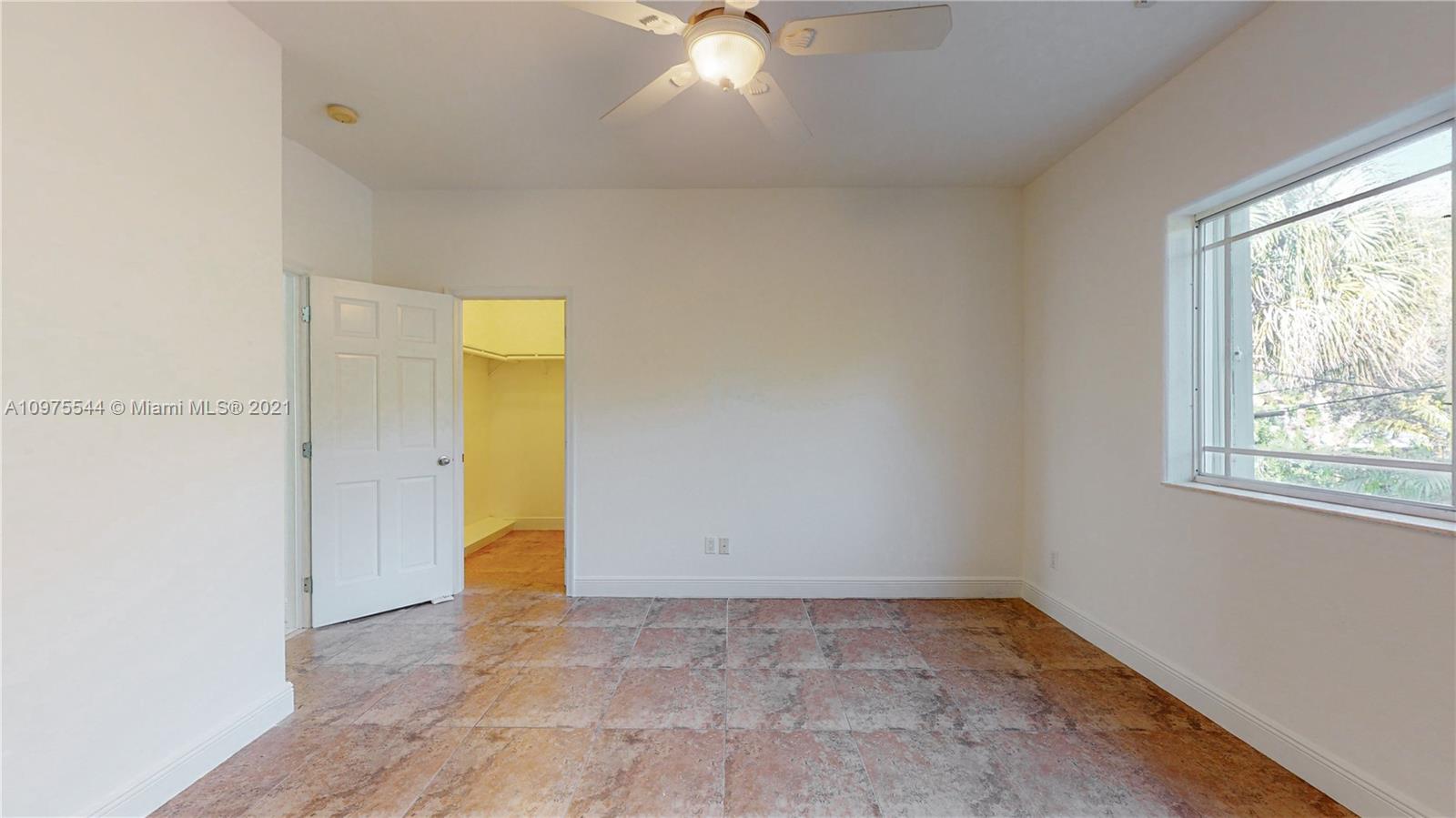 3088 Mary Street, Unit 2 Miami, FL 33133 - Photo 30 of 35 a view of an empty room with a window