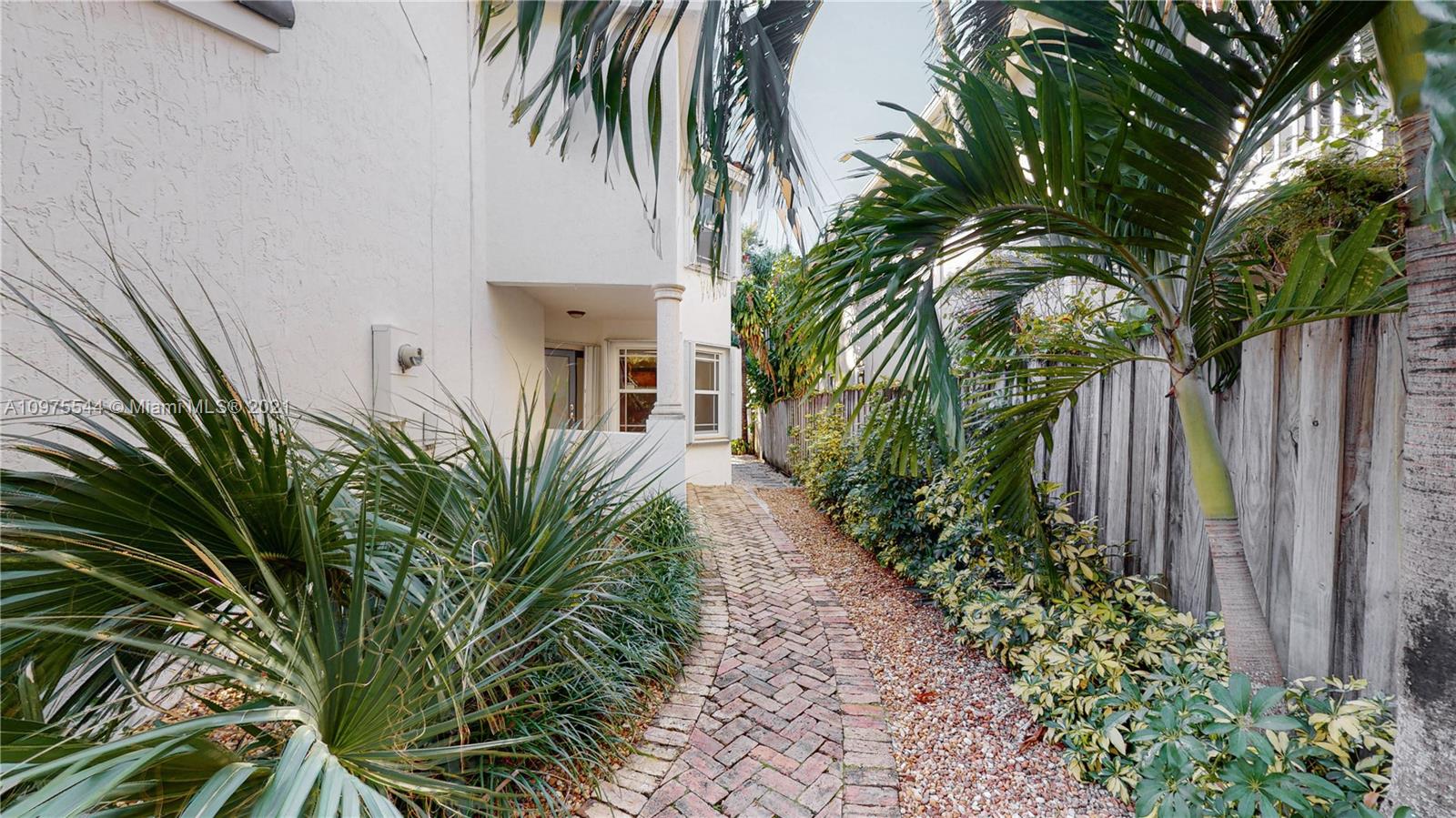 3088 Mary Street, Unit 2 Miami, FL 33133 - Photo 3 of 35 a view of a yard with plants