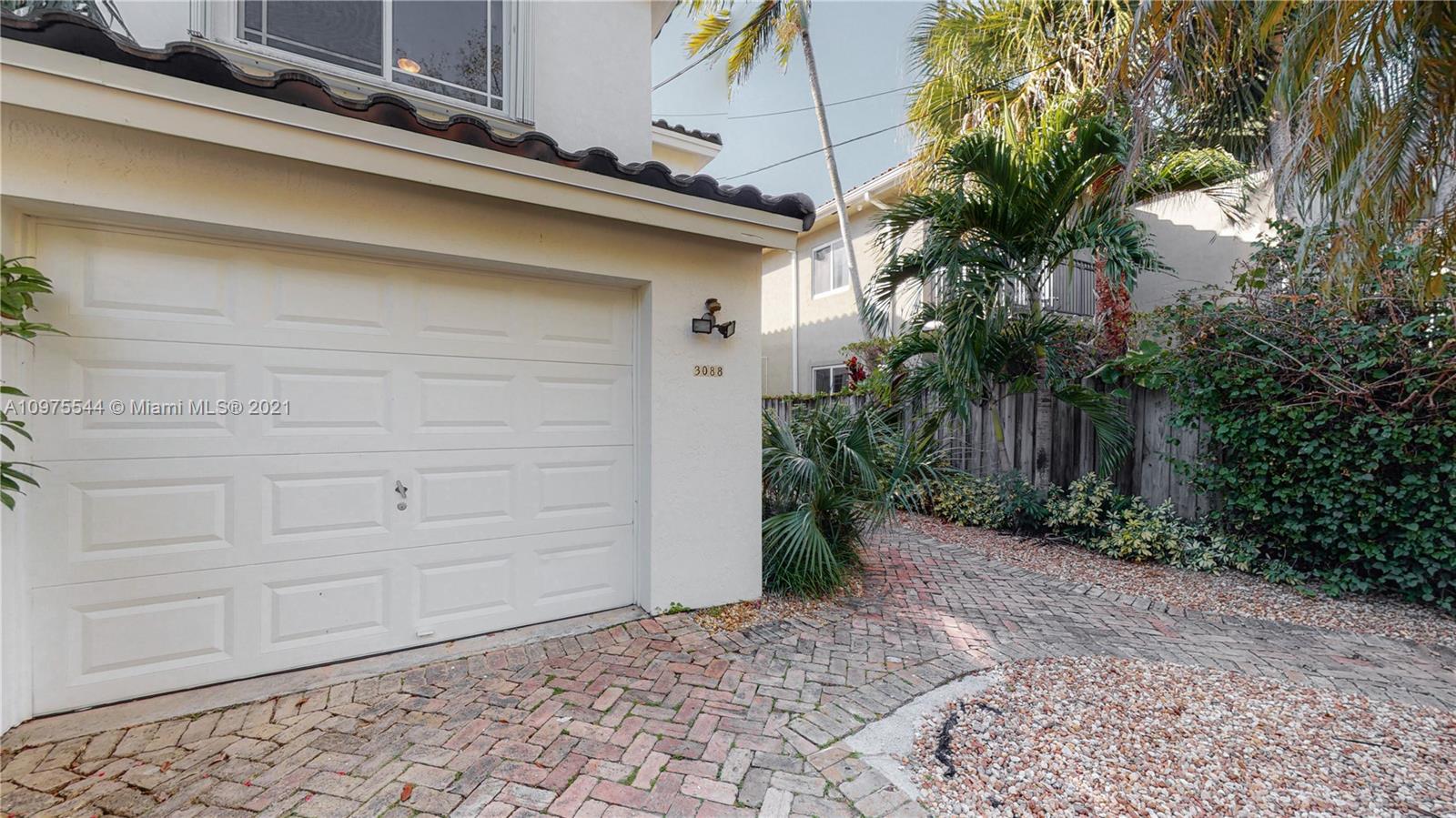 3088 Mary Street, Unit 2 Miami, FL 33133 - Photo 35 of 35 a backyard of a house with plants
